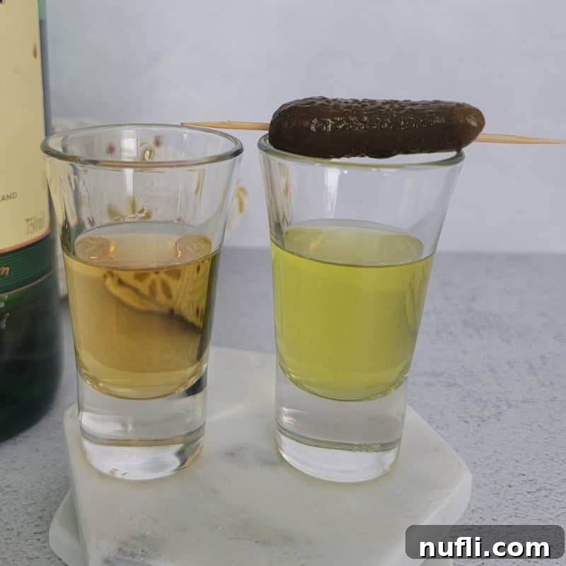 Pickleback shot in two shot glasses with a pickle garnish