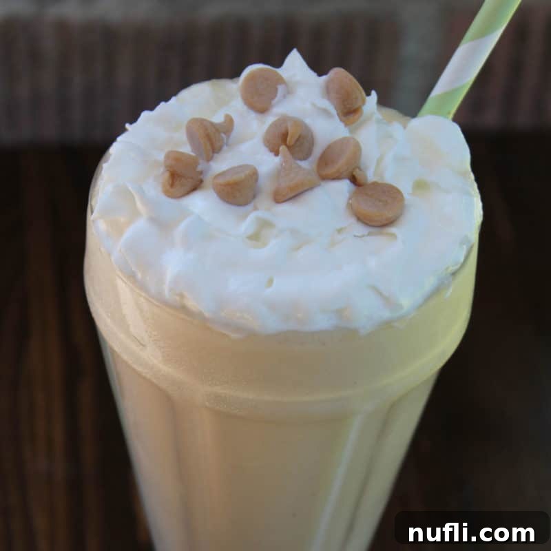 Irresistible Peanut Butter Creations 16 Sonic Peanut Butter Shake in a tall glass with whipped cream and peanut butter chips