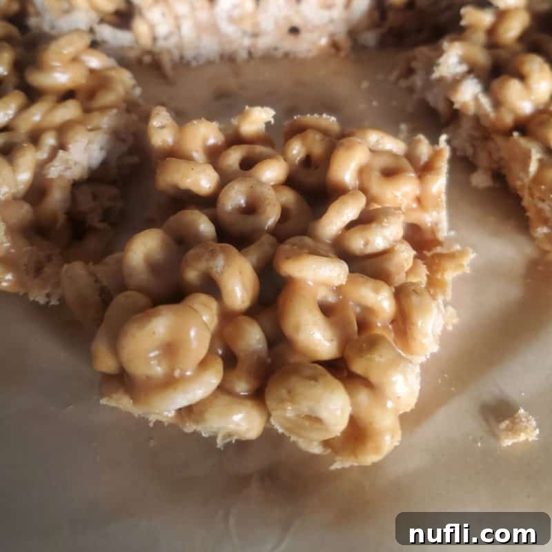 Irresistible Peanut Butter Creations 18 peanut butter cheerios square on parchment paper