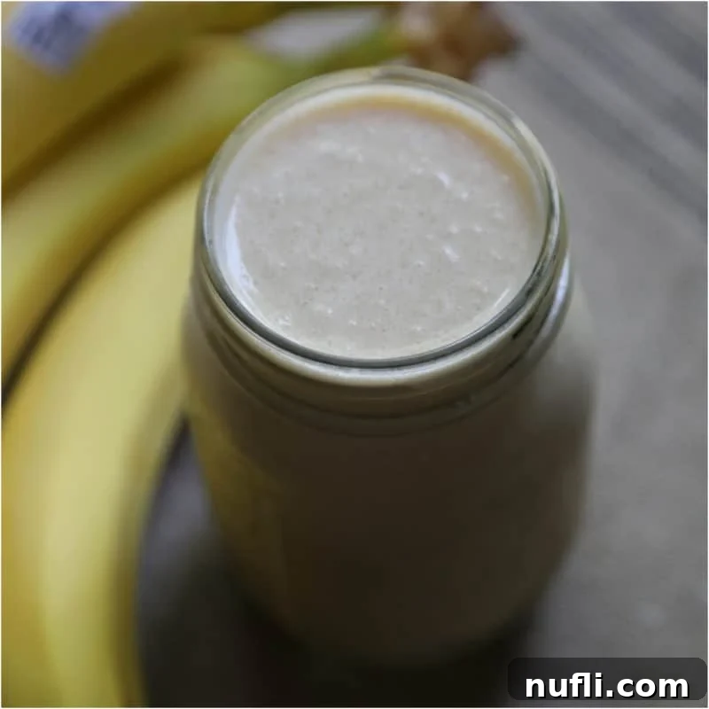 Irresistible Peanut Butter Creations 9 Peanut Butter Banana Smoothie in a mason jar next to bananas