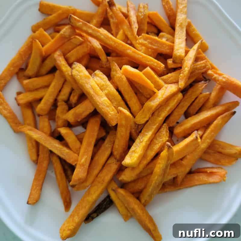 Over 30 Simple and Flavorful Vegetable Sides for Every Meal 29 Air fried sweet potato fries on a white plate