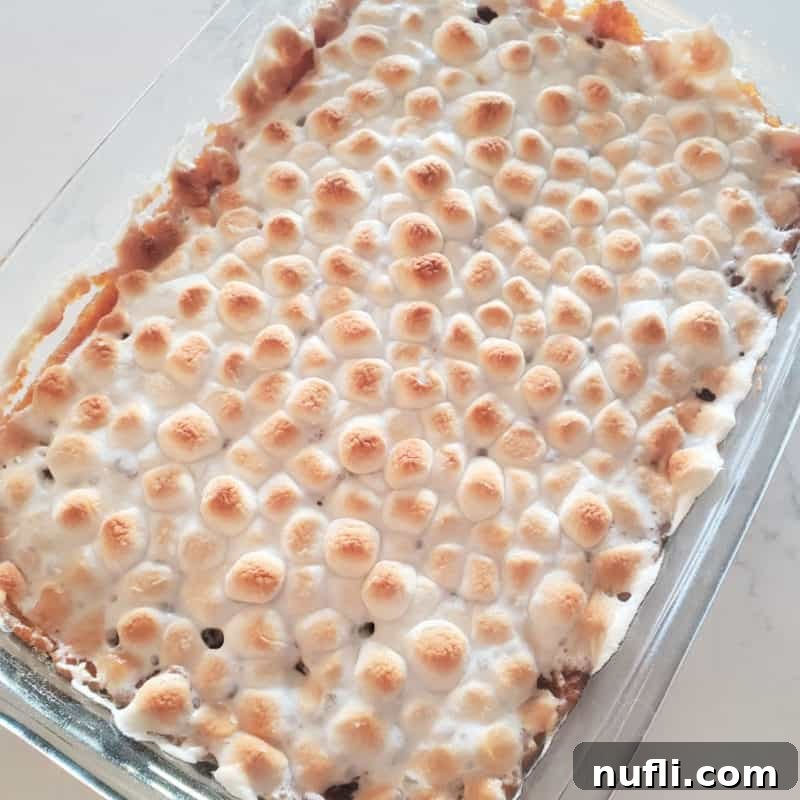 Over 30 Simple and Flavorful Vegetable Sides for Every Meal 4 sweet potato casserole dopped with mini marshmallows in a glass casserole dish