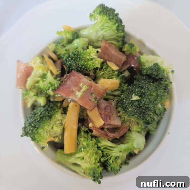 Over 30 Simple and Flavorful Vegetable Sides for Every Meal 34 Broccoli Bacon Salad in a white Bowl
