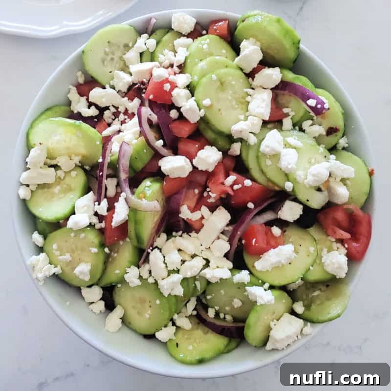 Over 30 Simple and Flavorful Vegetable Sides for Every Meal 35 Greek Cucumber Salad with Feta in a white bowl