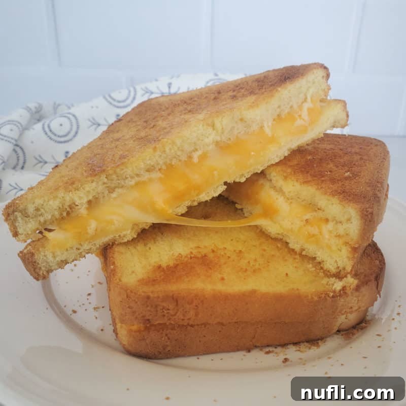 air fried grilled cheese stacked on a white plate