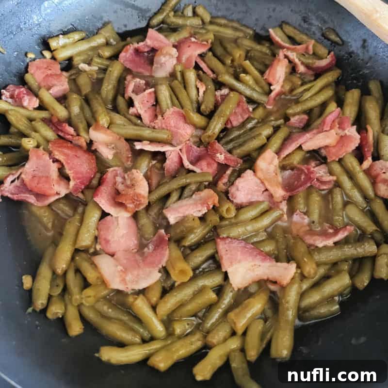 Southern Style Green Beans with bacon in a skillet