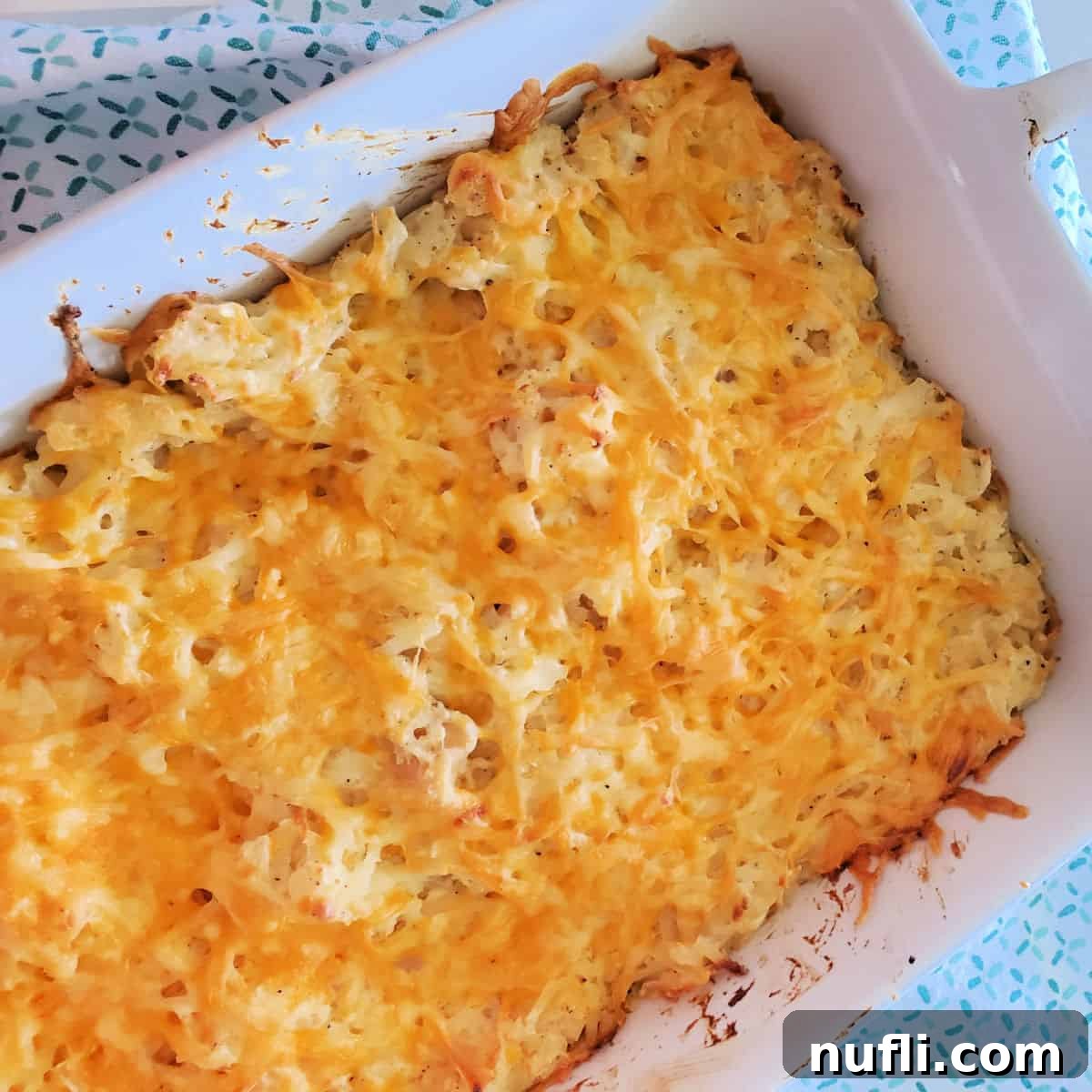 Cracker Barrel Hashbrown Casserole in a white casserole dish