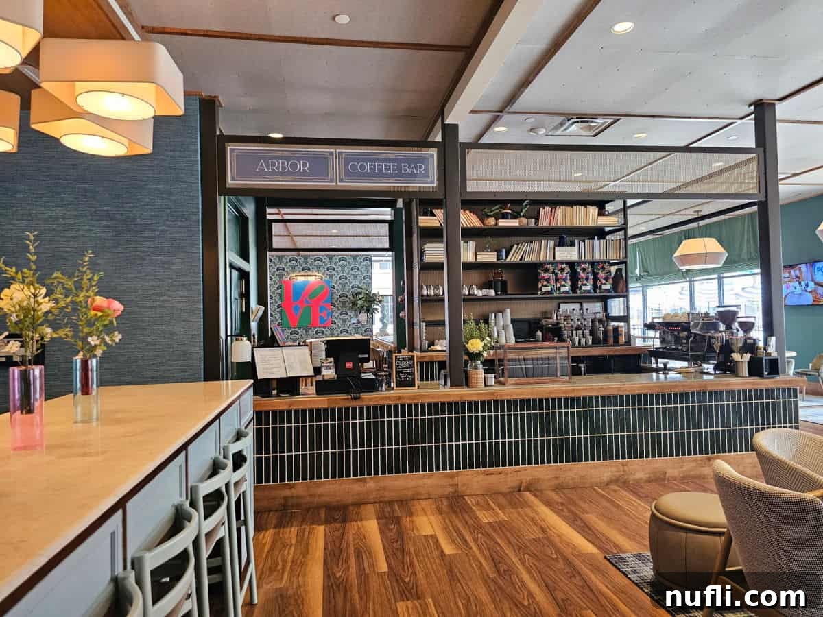 The Arbor Coffee Bar with long counter, LOVE Sign in the background, seating area