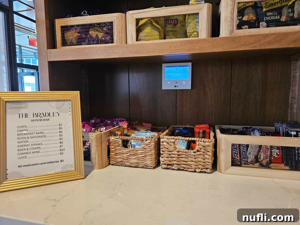 snacks in baskets next to a The Bradley Honor bar sign with prices