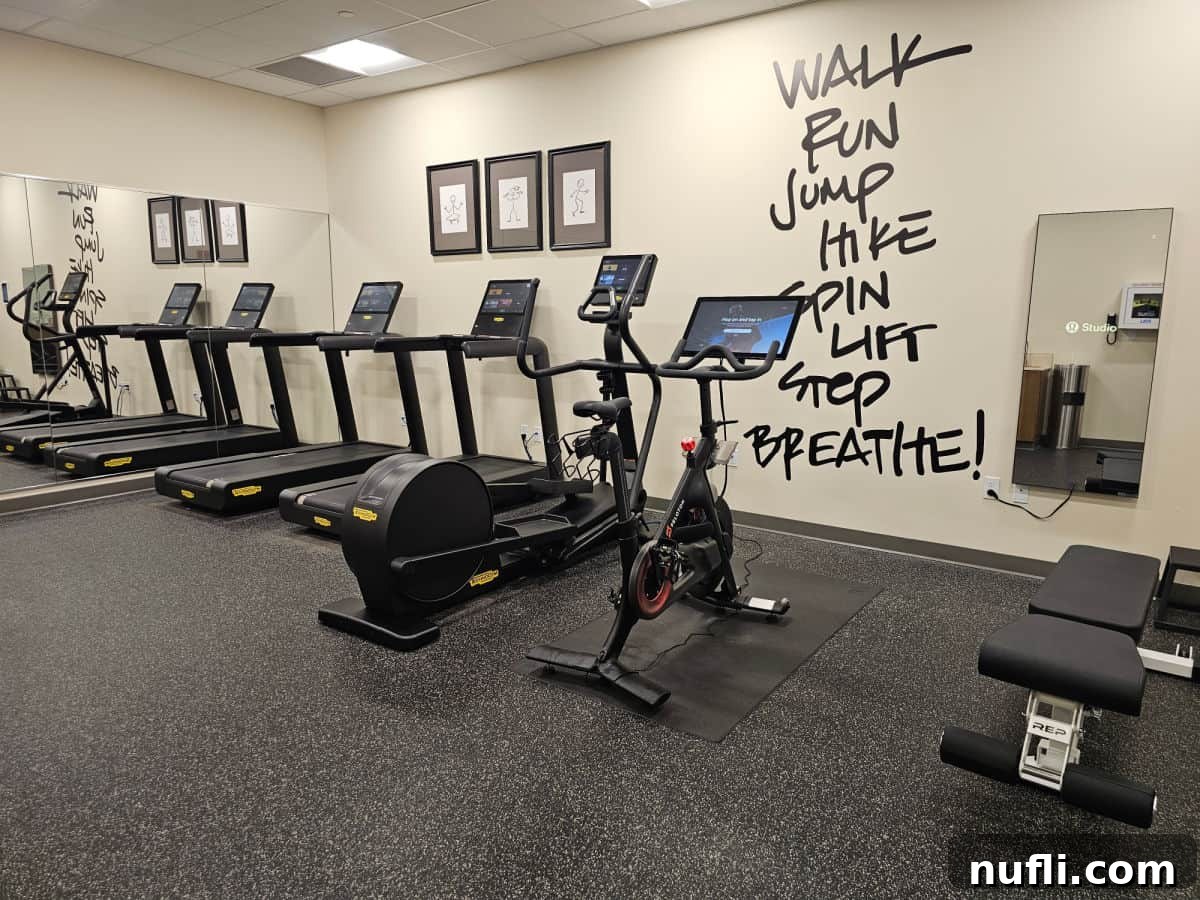Fitness center with walk, run, jump, hike, life, step, breathe painted on the wall