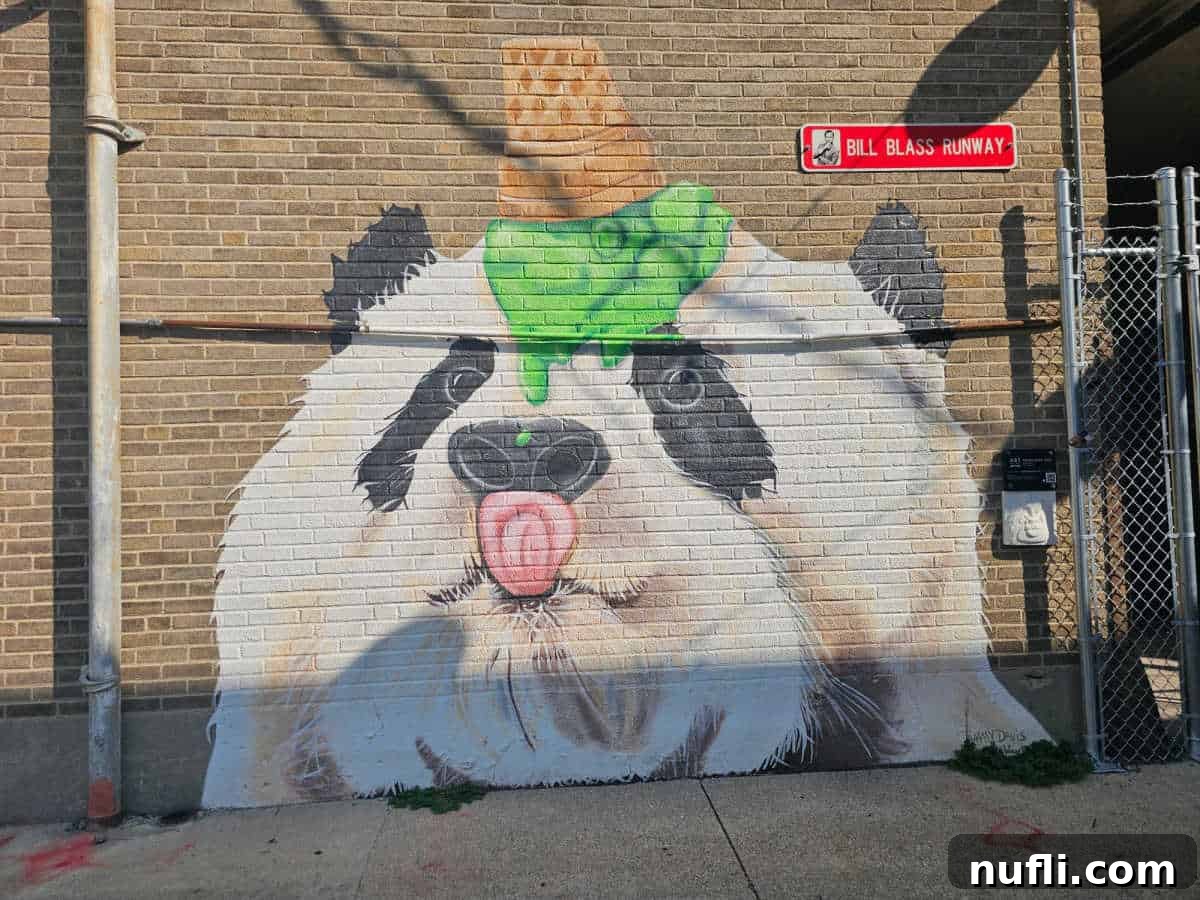 Panda mural with ice cream cone on the panda head dripping green ice cream and the pandas tonque out