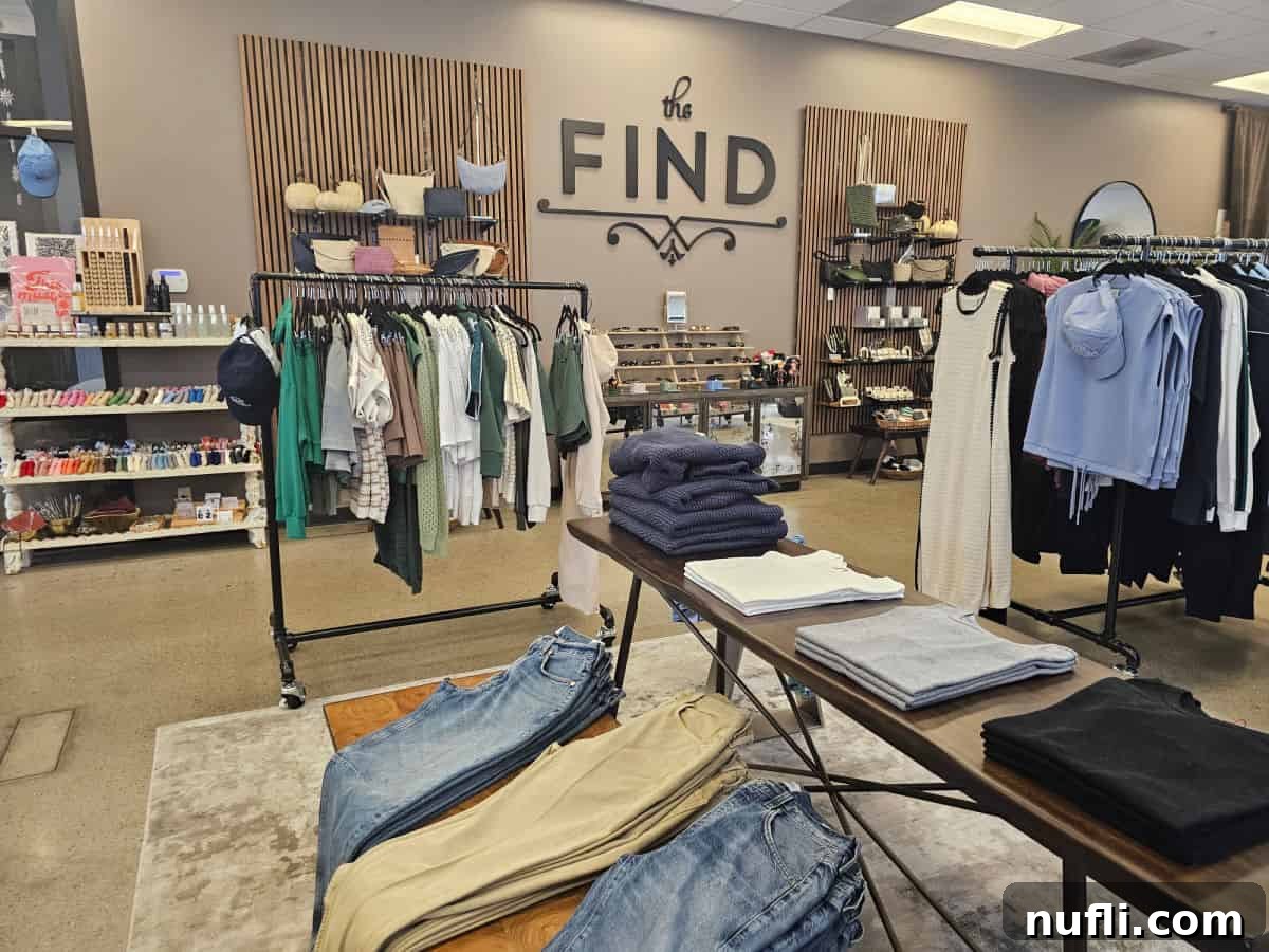 Find sign on the wall with racks of clothes and cute items