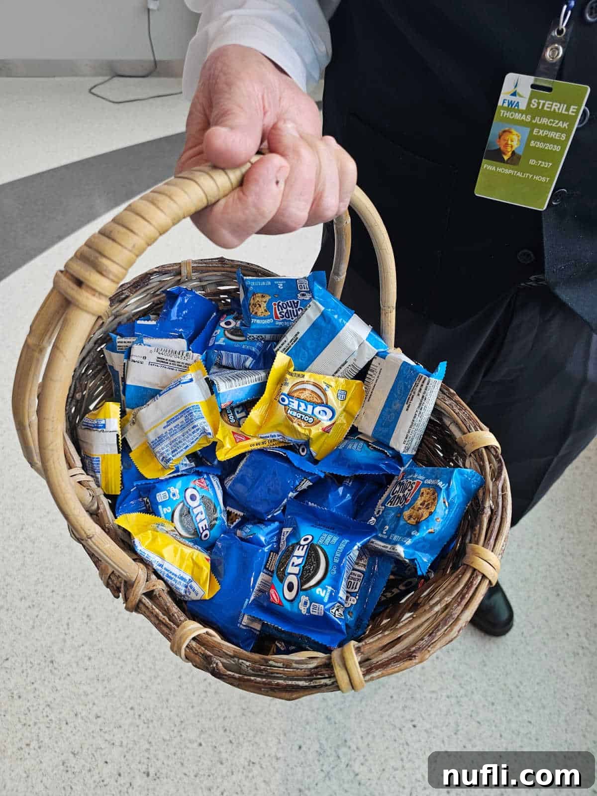 hand holding a basket of oreos