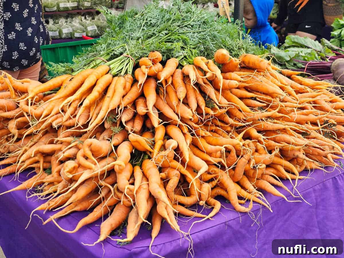 carrots stacked on a table at the farmers market in Fort Wayne