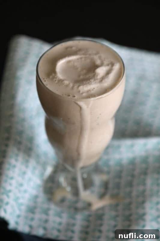 Copycat Wendy's Frosty with chocolate dripping down the side of the glass