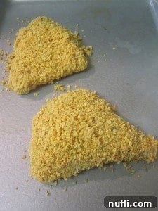 Pringles Crusted Chicken 5 Pringles coated chicken on a baking sheet