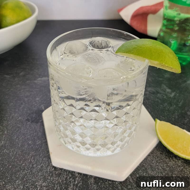 Delicious Tequila Drinks Made Easy 4 Tequila and Sprite cocktail served in a rocks glass with a fresh lime garnish, highlighting its simplicity and refreshment