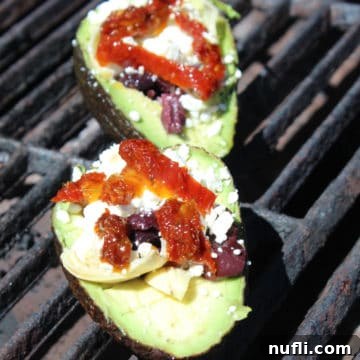 Grilled avocados with sun-dried tomatoes, feta, and kalamata olives