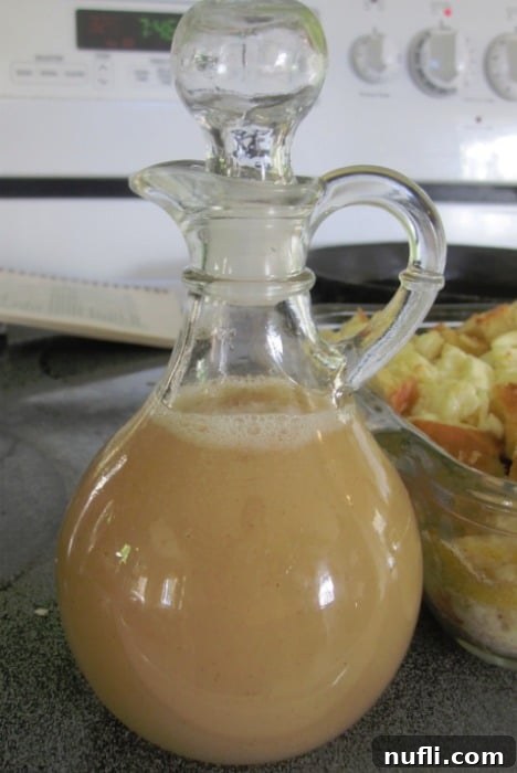 Sweet Cinnamon Elixir 2 Homemade Cinnamon Syrup in a glass container, ready to be poured