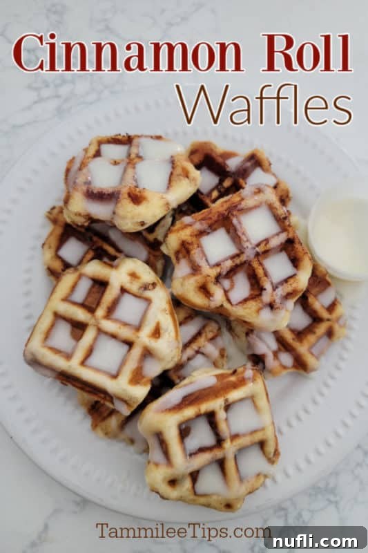 Cinnamon Roll Waffles over a plate filled with waffles covered in icing