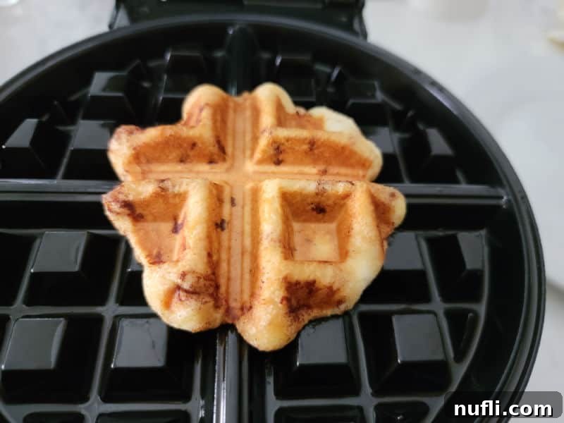 cinnamon roll baked on a waffle maker