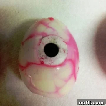 creepy red veined hard boiled egg on a paper towel