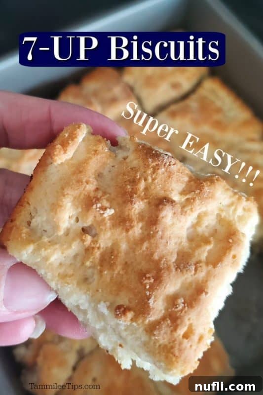 Super easy 7-up biscuits with text overlay, showing a hand holding a fluffy biscuit
