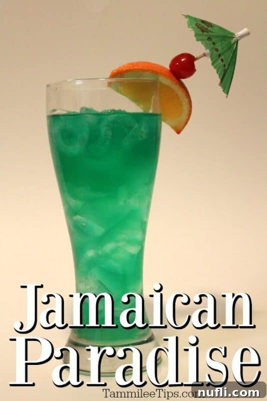 Vibrant green Chili's Jamaican Paradise cocktail garnished with orange slice and cherry, set on a tropical background.