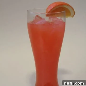 Chili's Calypso Cooler in a tall glass with an orange garnish, ready to be enjoyed