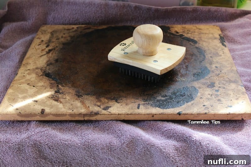 Mastering Pizza Stone Cleaning 2 Dirty Pizza Stone on a towel