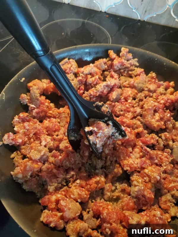 Mix n Chop breaking up ground meat in a skillet