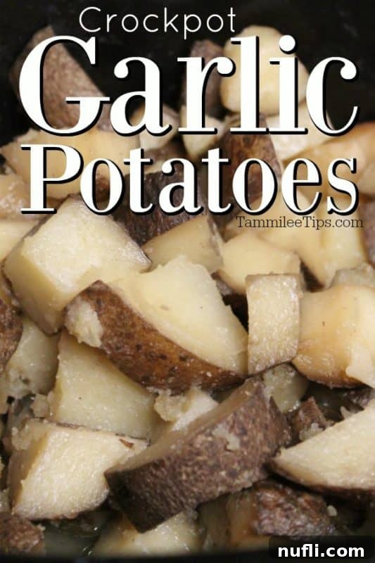 Close-up of fluffy Crockpot Garlic Potatoes garnished with fresh herbs in a white bowl, ready to serve.