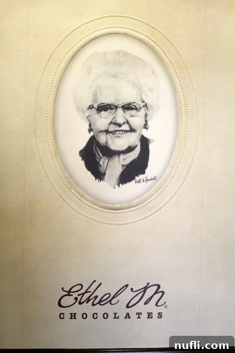 Ethel M Chocolate Factory building with a visible portion of its large solar panel array on the grounds, emphasizing sustainability.