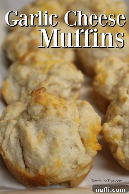 Garlic Cheese muffins over a platter of muffins