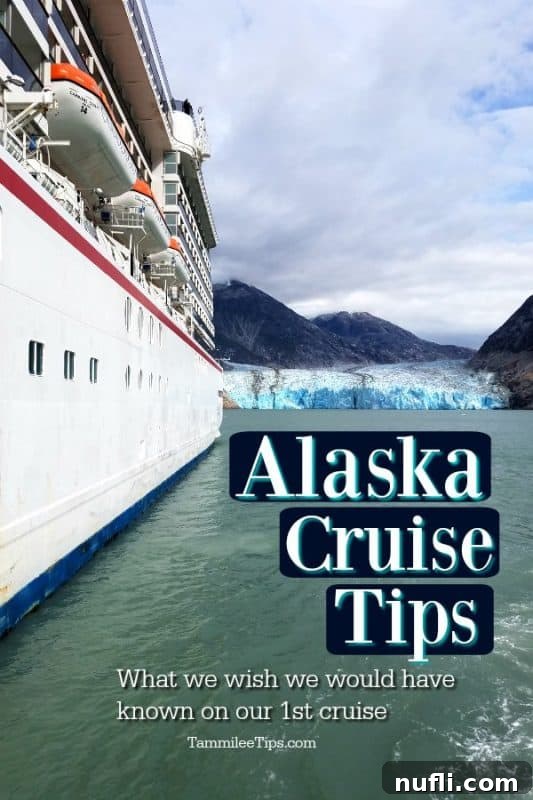 Alaska Cruise Tips: A cruise ship sailing past a glacier with snow-capped mountains in the background