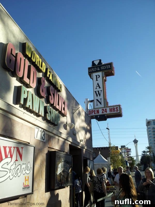 Las Vegas: A Pawn Stars Pilgrimage 2 World Famous Gold & Silver Pawn Shop sign with people standing below it.