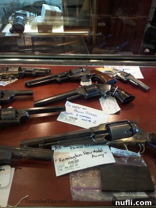 Las Vegas: A Pawn Stars Pilgrimage 3 Historic guns on display with price tags