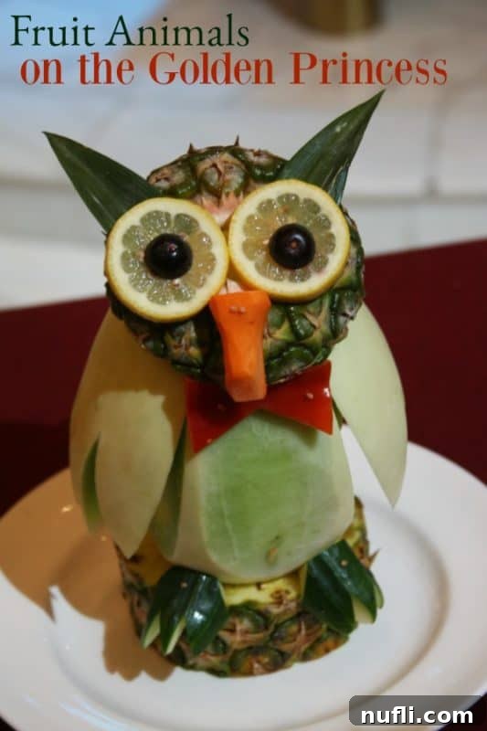 Detailed fruit animal owl crafted from melon, standing proudly in a cruise ship display.