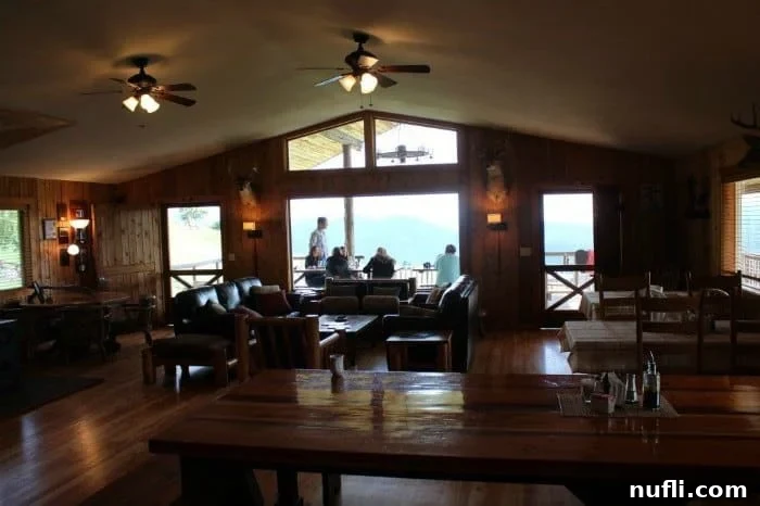 Vibrant outdoor dining area with guests enjoying food and conversation on a spacious porch overlooking the picturesque landscape at Bull Hill Guest Ranch.