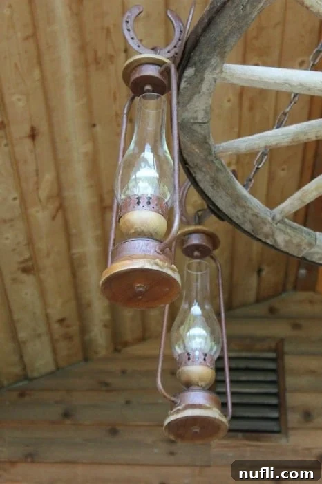 Rustic wagon wheel adorned with charming lanterns, creating a warm and inviting atmosphere, typical of the thoughtful ranch decor at Bull Hill Guest Ranch.