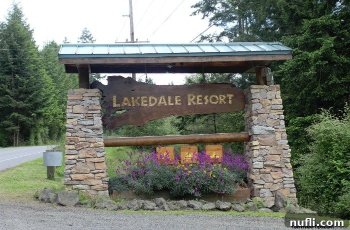 Your Log Cabin Adventure Awaits at Lakedale Resort, San Juan Islands 2 Lakedale resort sign with blooming flowers at its base, welcoming visitors