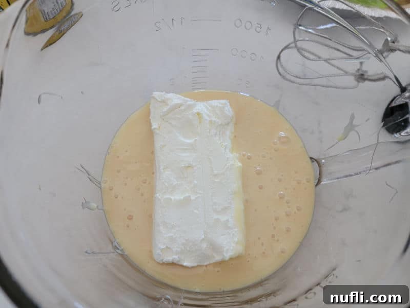 Sunshine Lemon Icebox Pie 4 cream cheese and condensed milk in a glass batter bowl