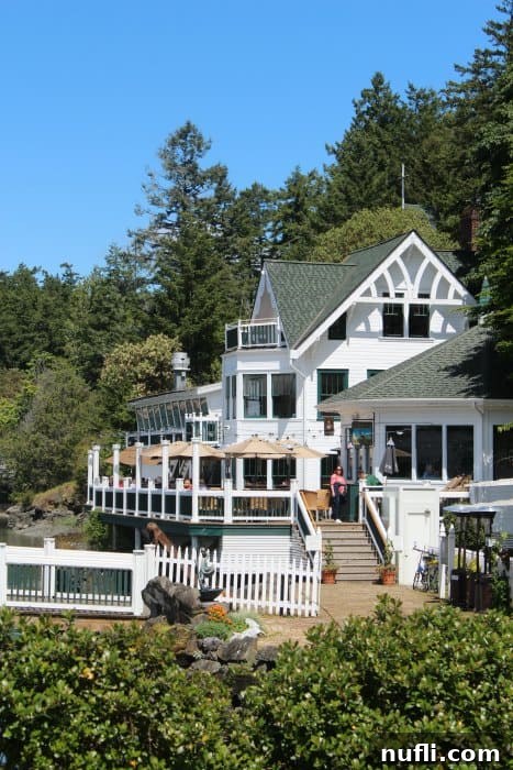 Mansion grill white restaurant with people on the deck 