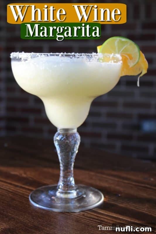 Crisp White Wine Margarita 2 White Wine Margarita text over a margarita garnished with a lime and orange