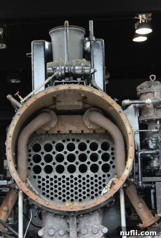 Detailed view inside a classic train engine, showing various controls and gauges.