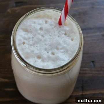 Dunkin Donuts Coffee Coolatta in a mason jar with a striped straw