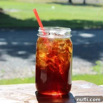 McDonalds Sweet Tea in a mason jar with a red straw