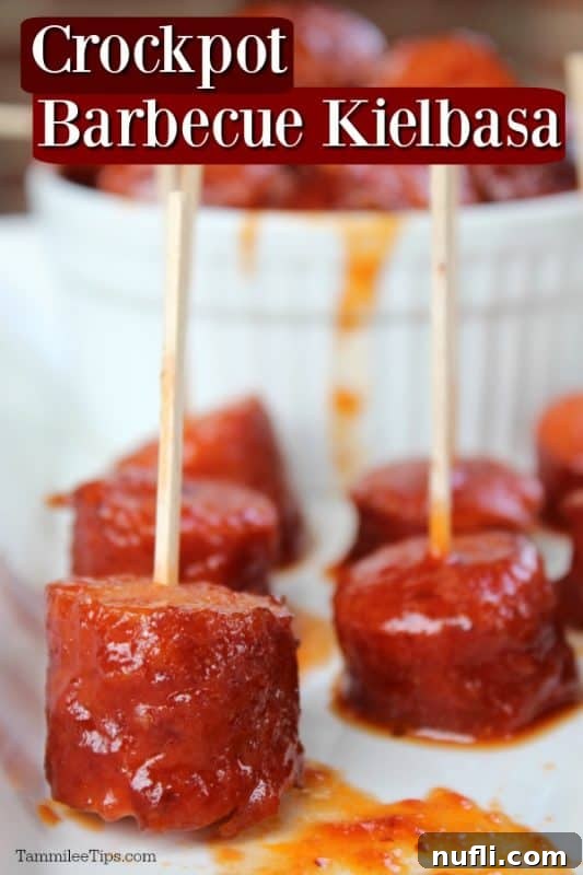 Zesty Slow Cooker Spicy BBQ Kielbasa 2 Crockpot Barbecue Kielbasa text over a white platter with kielbasa bites with toothpicks and a bowl of kielbasa in the background.