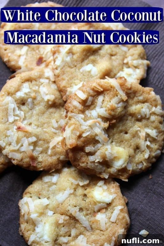 Coconut macadamia nut cookies sitting on a brown paper napkin