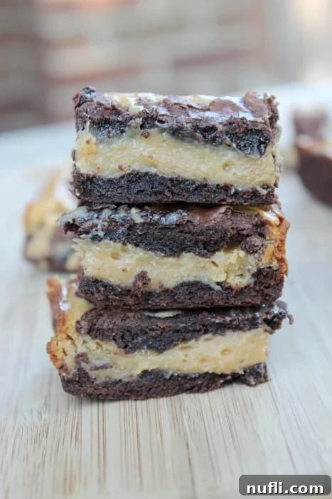 Irresistible Buckeye Bars 3 stack of buckeye bars on a cutting board